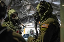 U.S. Air National Guard Airmen assigned to the 134th Air Refueling Wing discuss logistical movements inside a KC-135R Stratotanker during a training exercise, April 6, 2025 at McGhee Tyson Air National Guard Base, Tennessee.
