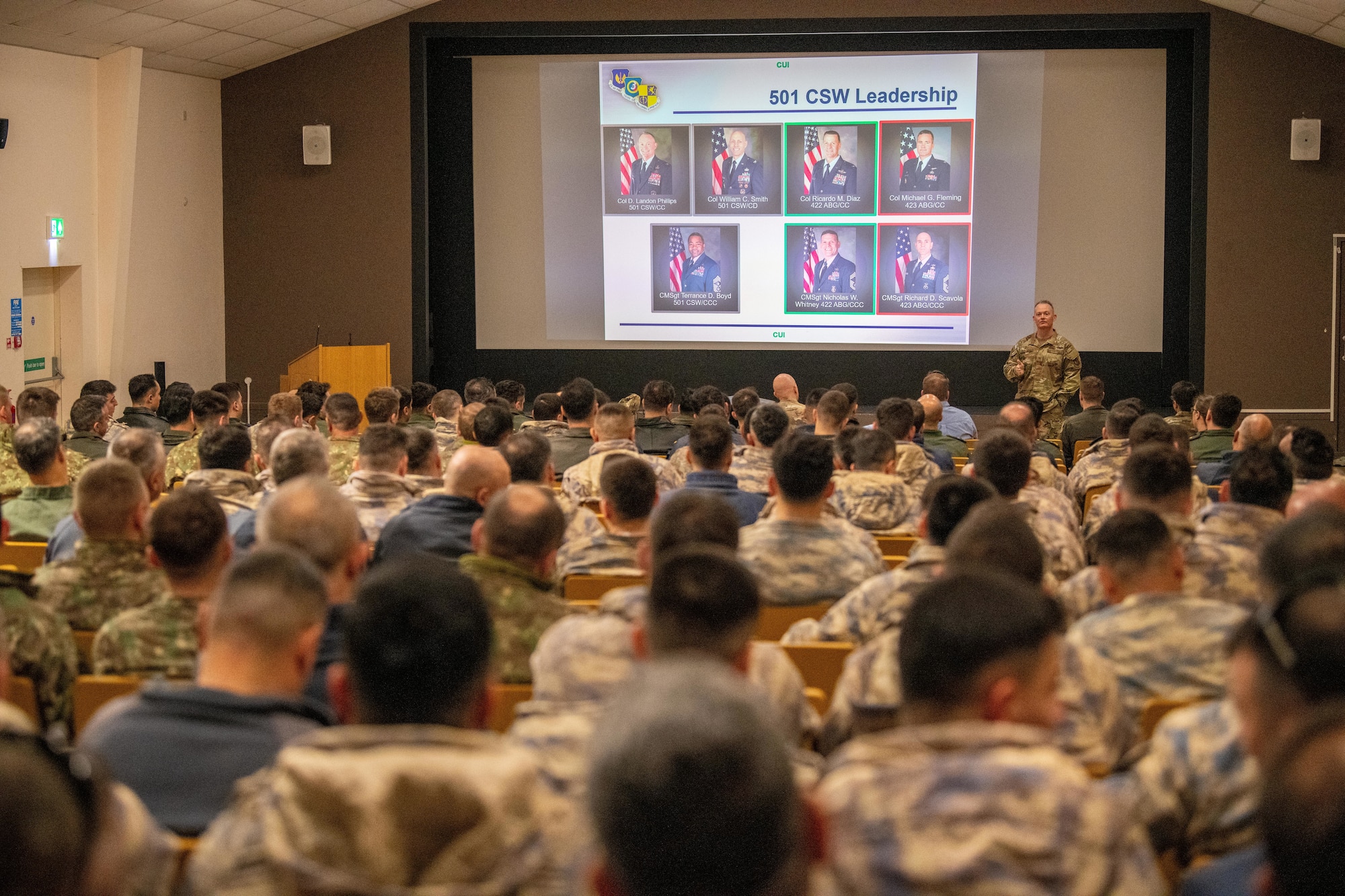 A commander gives remarks during an inprocessing brief