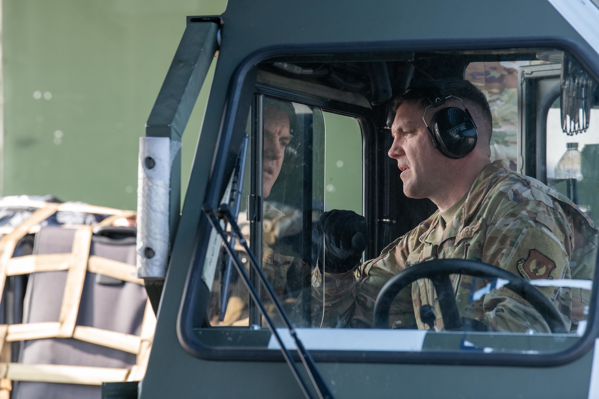 Airman operates a K-loader during a cargo offload