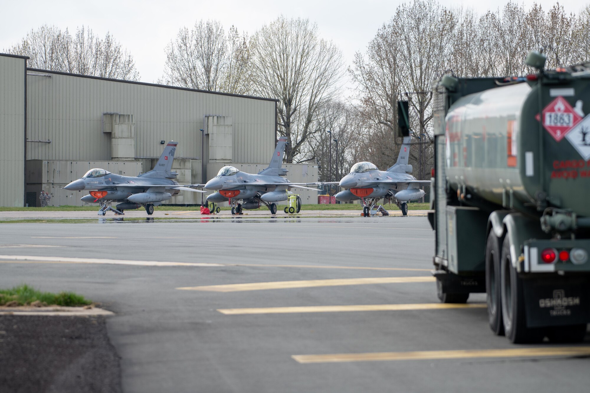 Three Turkish Air Force (THK) F-16C Fighting Falcons sit parked on the flightline