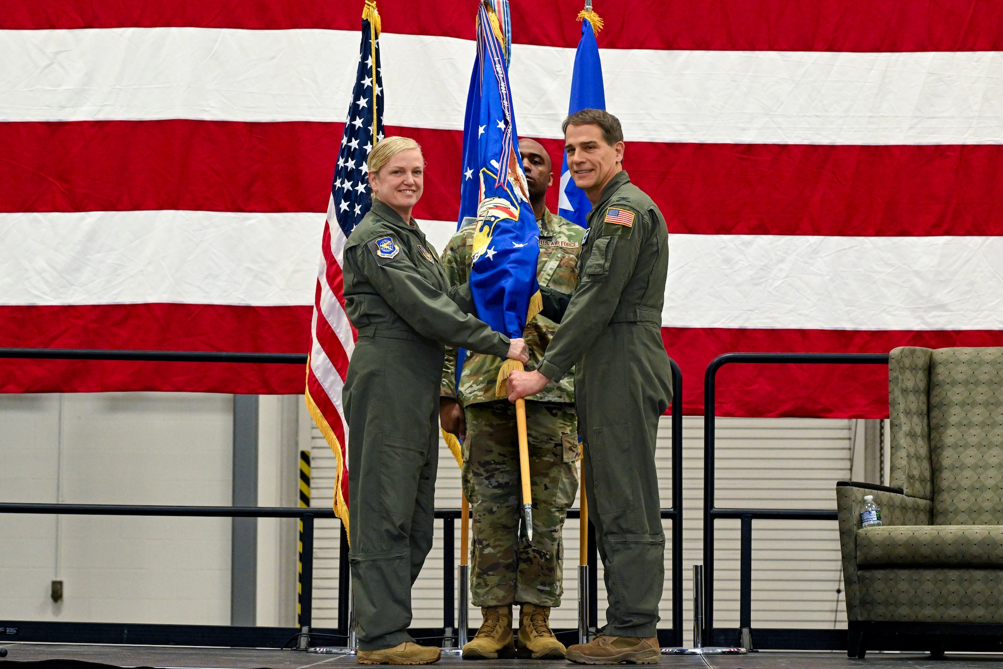 Col. Chris Sedlacek, 910th Airlift Wing commander, receives the wing guidon from Maj. Gen. Melissa Coburn, 22nd Air Force commander, at Youngstown Air Reserve Station, Ohio, April 6, 2025.