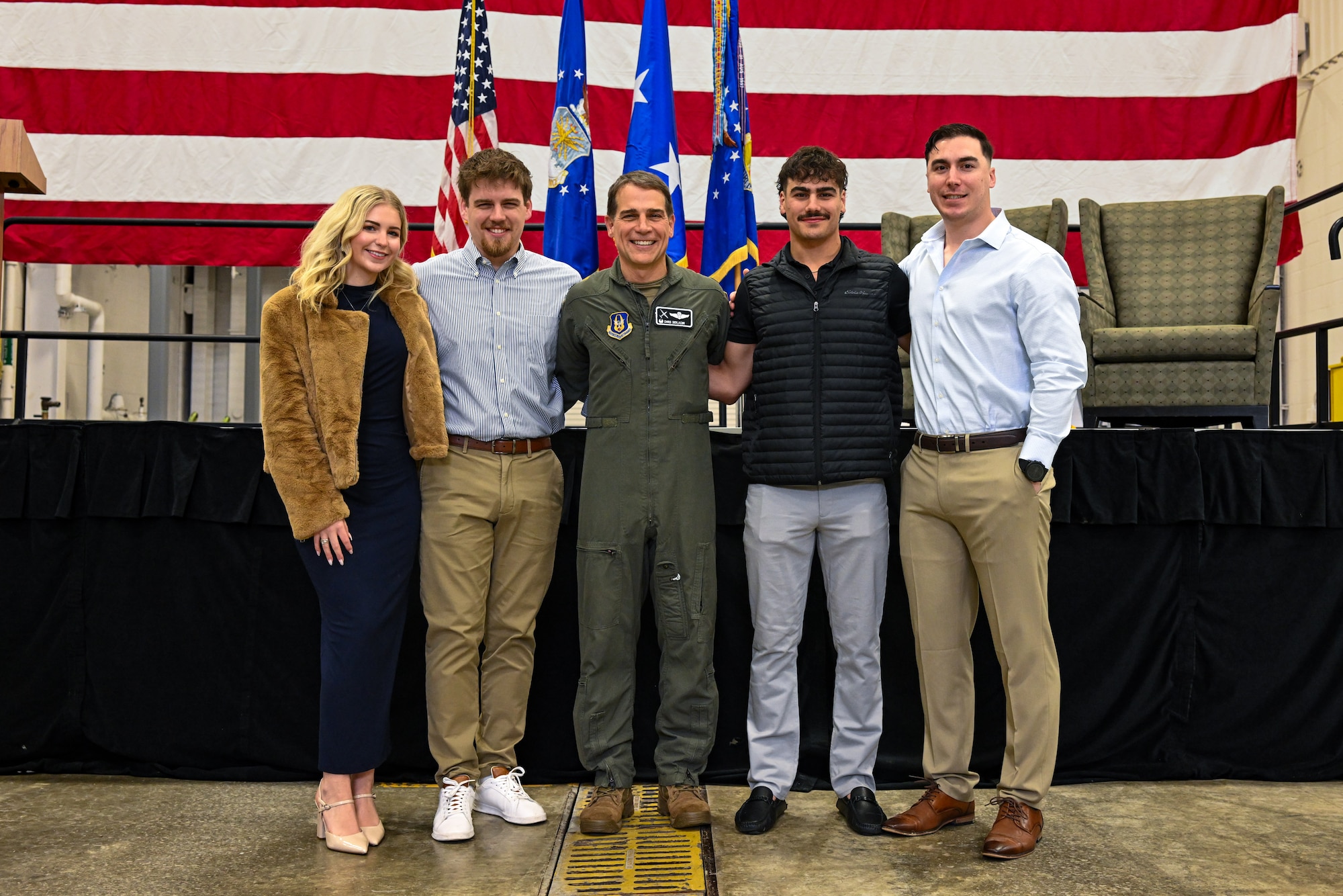 Col. Chris Sedlacek, 910th Airlift Wing commander, poses for a photo with his children after his assumption of command ceremony at Youngstown Air Reserve Station, Ohio, April 6, 2025.