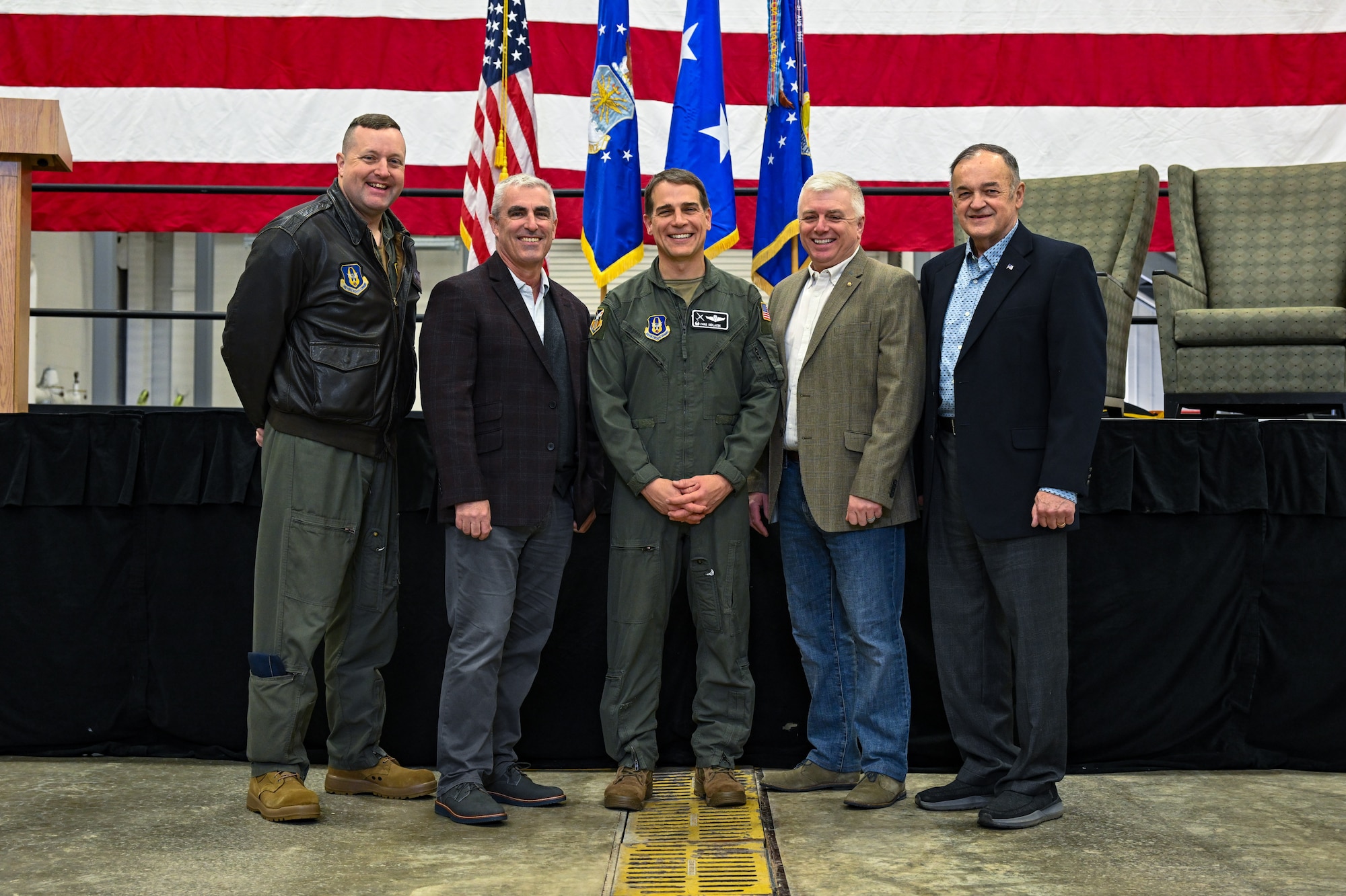 Col. Chris Sedlacek, 910th Airlift Wing commander, poses for a photo with current and retired Air Force officers after his assumption of command ceremony at Youngstown Air Reserve Station, Ohio, April 6, 2025.