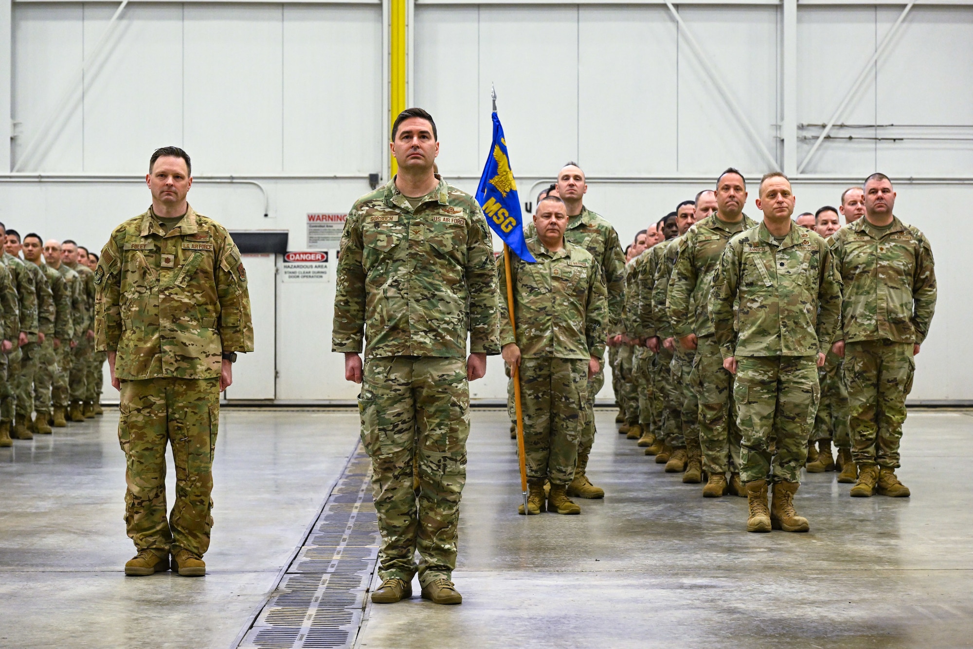 Citizen Airmen of the 910th Airlift Wing stand at the position of attention during an assumption of command ceremony at Youngstown Air Reserve Station, Ohio, April 6, 2025.