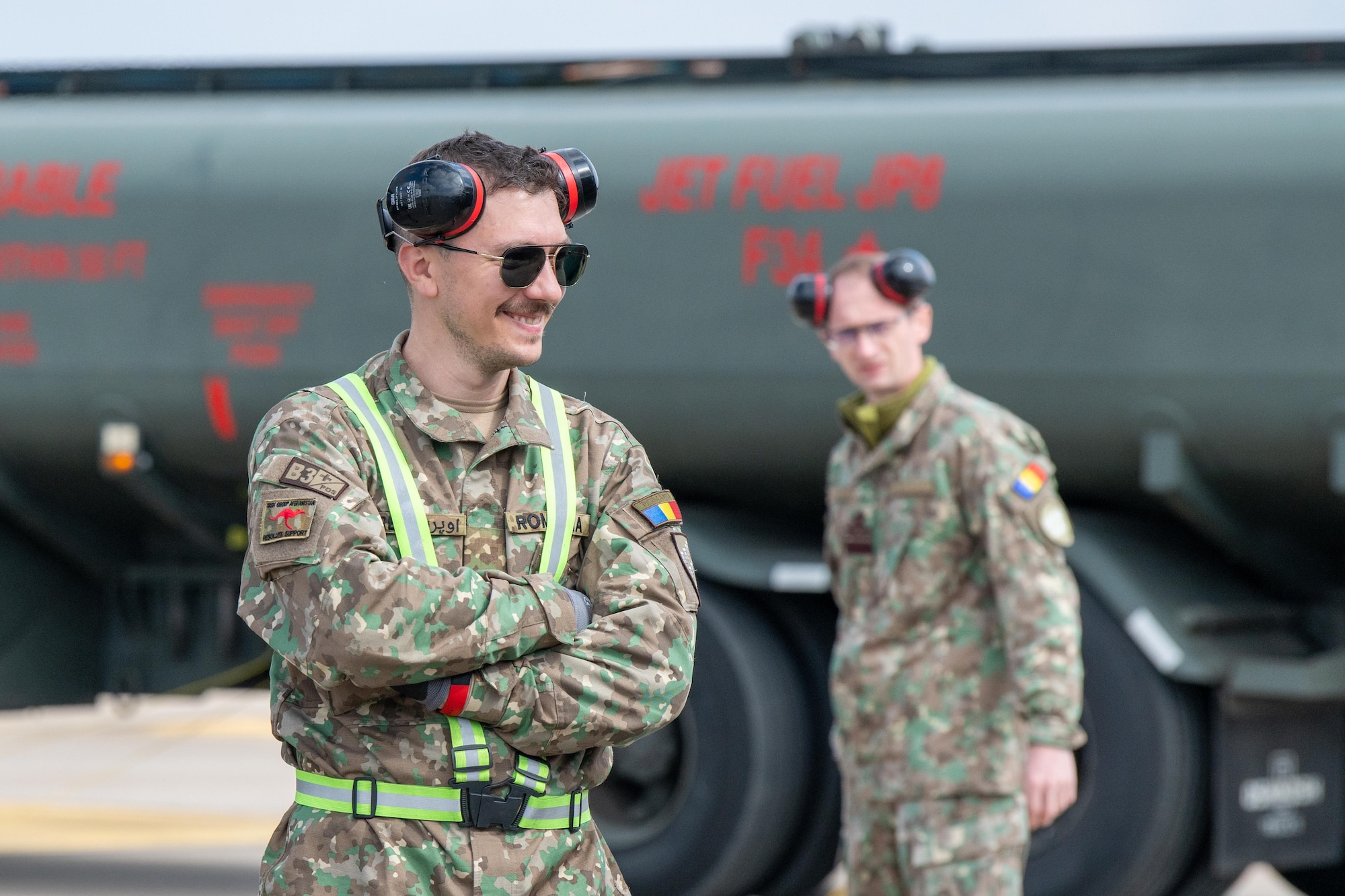 A Romanian Air Force (RoAF) crew chief smiles
