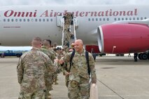 U.S. Air Force Airmen assigned to the 9th Reconnaissance Wing, are greeted by family members and Beale personnel as they return from a six-month deployment at Beale Air Force Base, California, April 7, 2025.