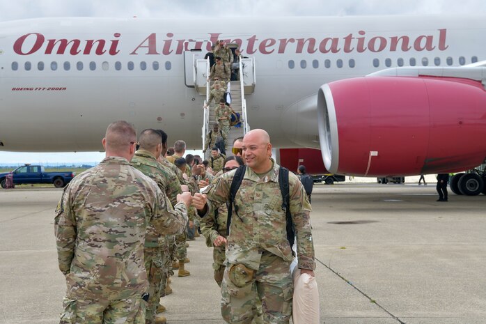 U.S. Air Force Airmen assigned to the 9th Reconnaissance Wing, are greeted by family members and Beale personnel as they return from a six-month deployment at Beale Air Force Base, California, April 7, 2025.