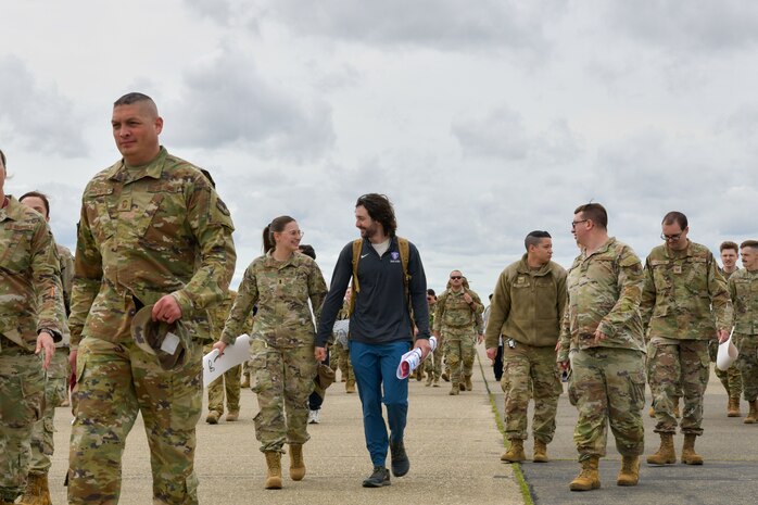 U.S. Air Force Airmen assigned to the 9th Reconnaissance Wing, are greeted by family members and Beale personnel as they return from a six-month deployment at Beale Air Force Base, California, April 7, 2025