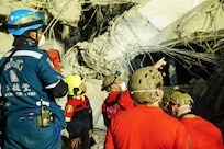 U.S. Indo-Pacific Command servicemembers work alongside Thai military and first responders near the collapsed State Audit Office building in Bangkok, which fell after a 7.7 magnitude earthquake affected Thailand and its neighboring countries on March 28, 2025.
