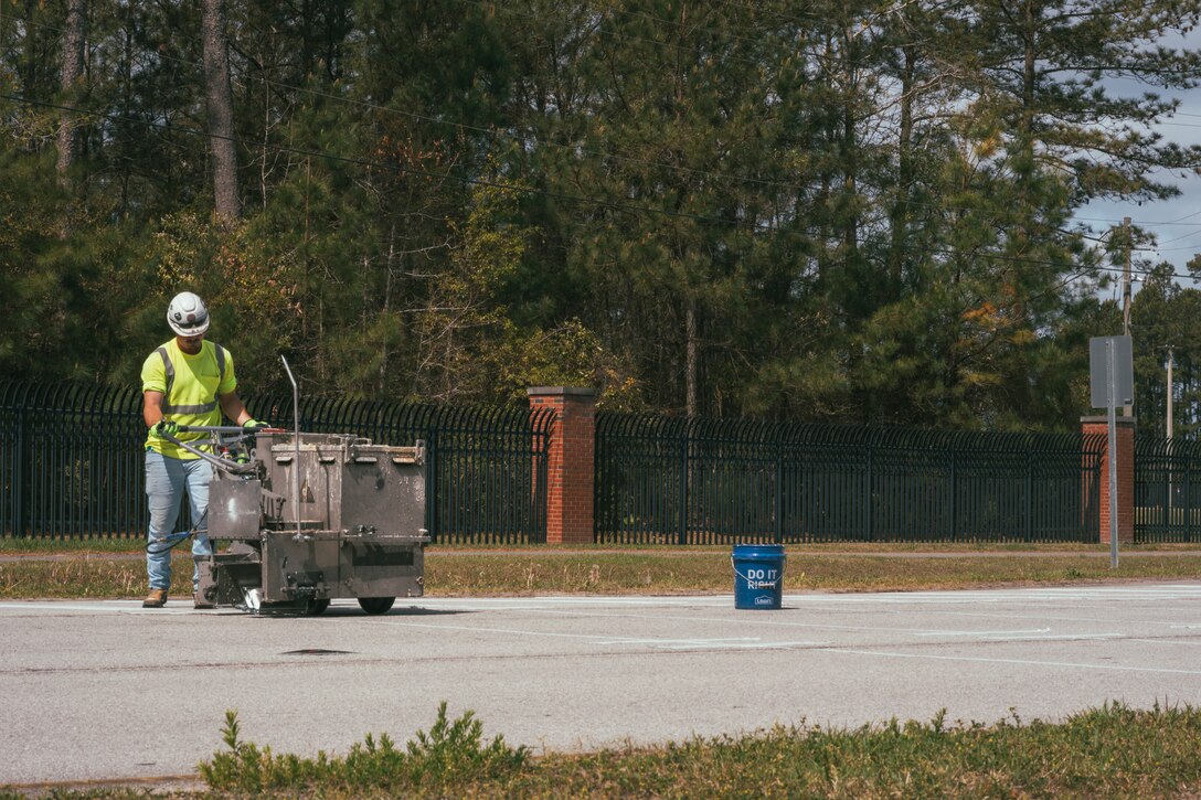 New rumble strips are laid at the Holcomb Gate on Marine Corps Base Camp Lejeune, North Carolina, April 5, 2025. As part of a broader effort to increase driver safety at Marine Corps Base Camp Lejeune and Marine Corps Air Station New River, rumble strips are being added to roadways. The strips serve as an additional safety measure that will alert drivers to the presence of active vehicle barrier systems, which can be deployed any time. (U.S. Marine Corps photo by Staff Sgt. Andrew Skiver)