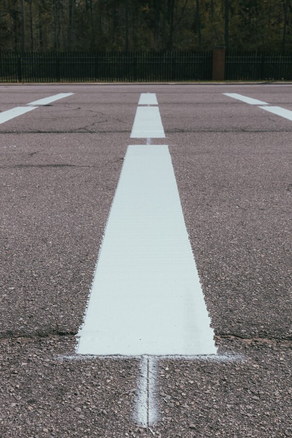New rumble strips are laid at the Holcomb Gate on Marine Corps Base Camp Lejeune, North Carolina, April 5, 2025. As part of a broader effort to increase driver safety at Marine Corps Base Camp Lejeune and Marine Corps Air Station New River, rumble strips are being added to roadways. The strips serve as an additional safety measure that will alert drivers to the presence of active vehicle barrier systems, which can be deployed any time. (U.S. Marine Corps photo by Staff Sgt. Andrew Skiver)