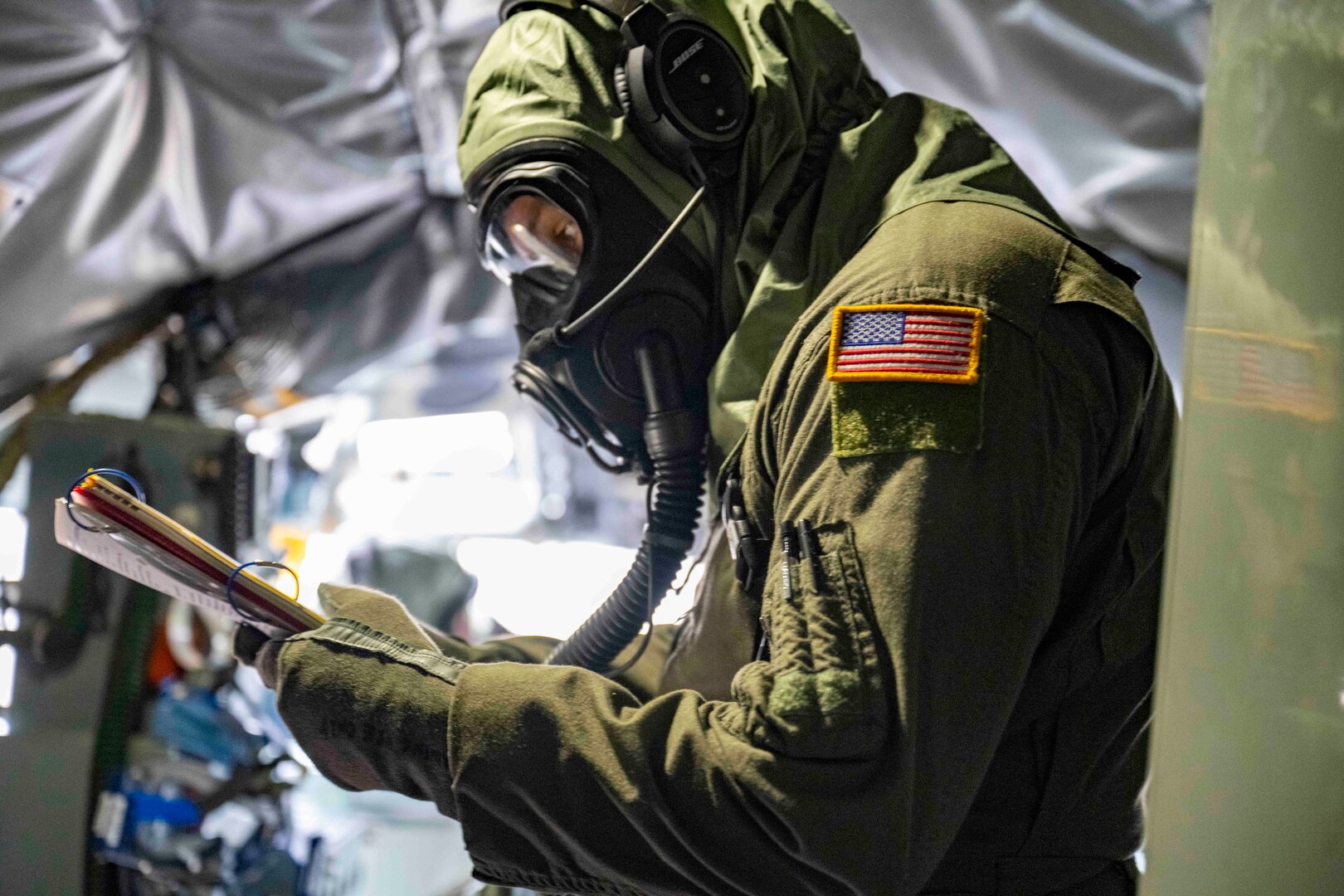 U.S. Air National Guard Airman assigned to the 134th Air Refueling Wing accesses a checklist inside a KC-135R Stratotanker during a training exercise at McGhee Tyson Air National Guard Base, Tennessee