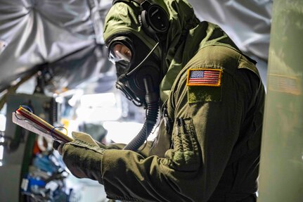 U.S. Air National Guard Airman assigned to the 134th Air Refueling Wing accesses a checklist inside a KC-135R Stratotanker during a training exercise at McGhee Tyson Air National Guard Base, Tennessee