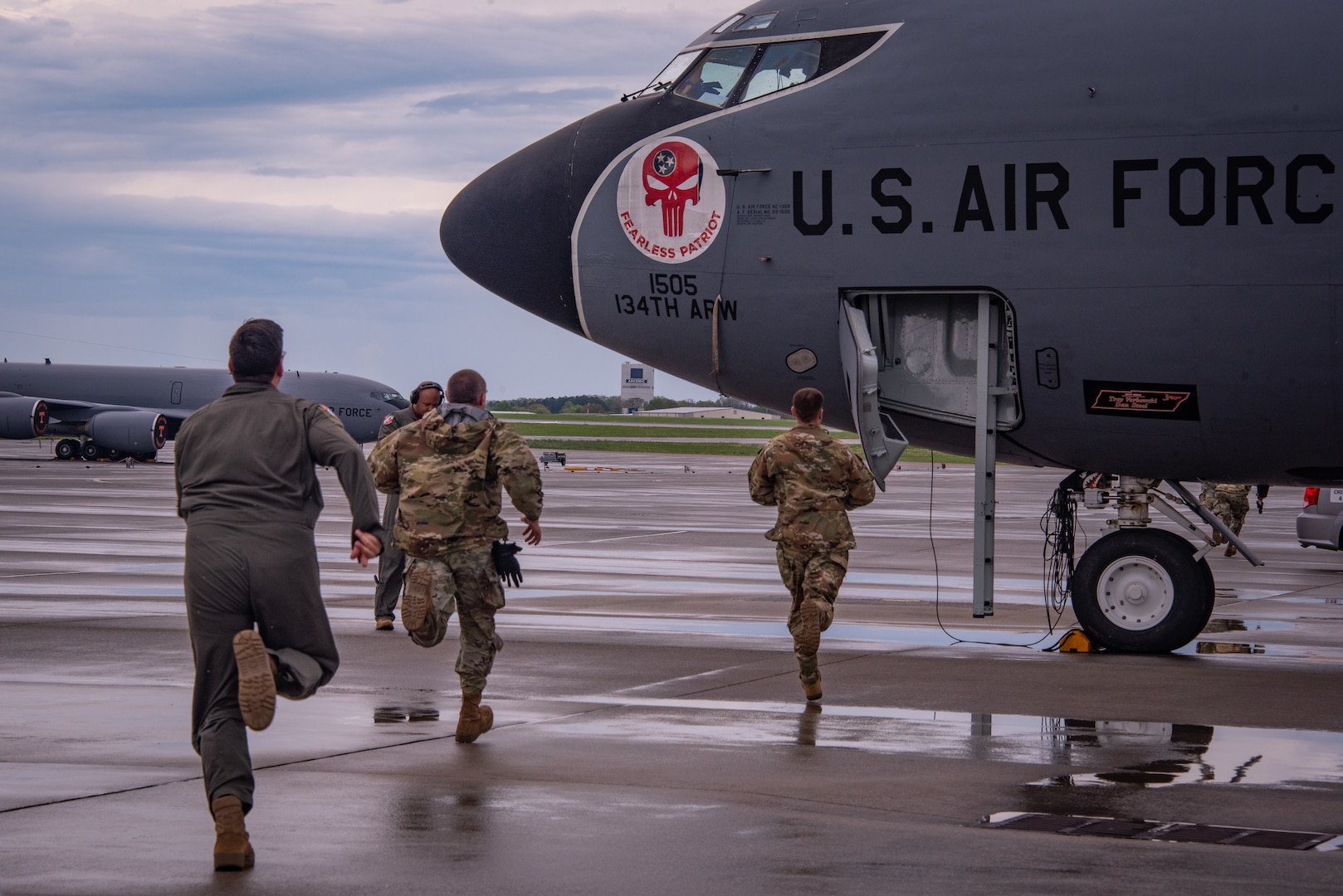 U.S. Air National Guard Airmen assigned to the 134th Operations Group run toward a KC-135R Stratotanker as part of an alert response during a Nuclear Operational Readiness Exercise at McGhee Tyson Air National Guard Base, Tennessee.