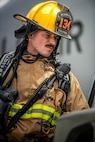 U.S. Air National Guard Staff Sgt. Jacob Thurber, 134th Civil Engineer Squadron firefighter, inspects a mock fuel spill during a training exercise on McGhee Tyson Air National Guard Base, Tennessee.