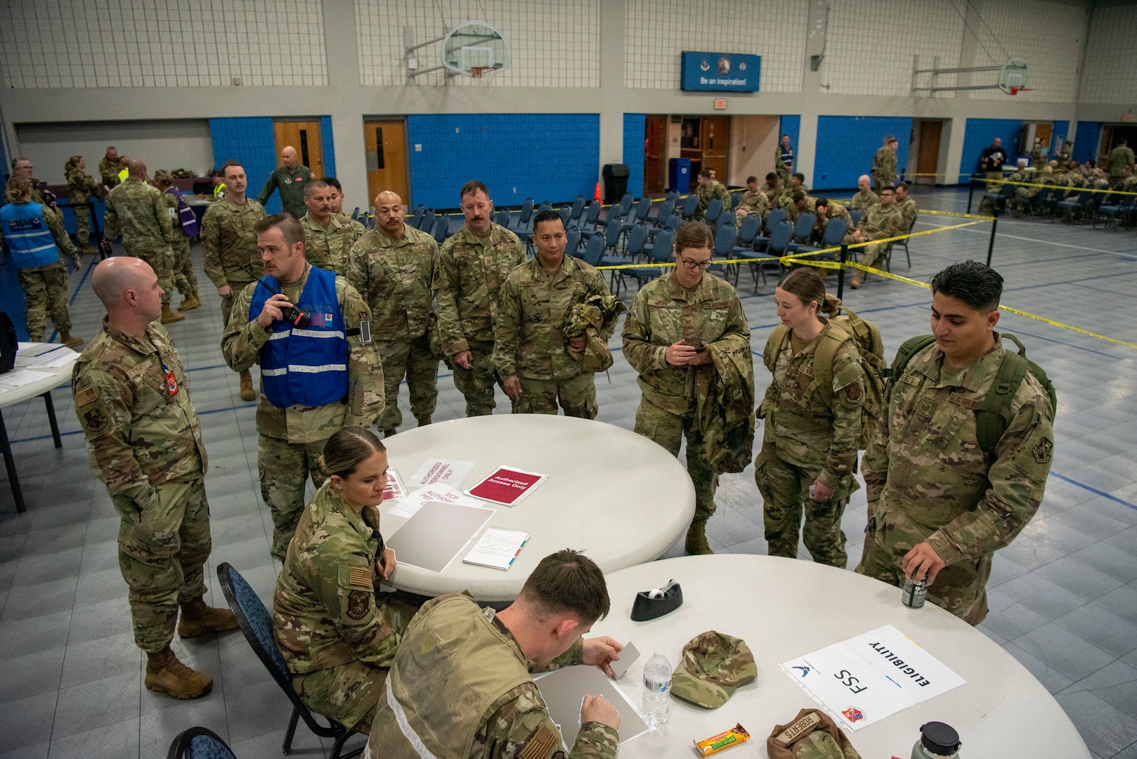 U.S. Air National Guard Airmen assigned to the 134th Air Refueling Wing walk through a Personnel Deployment Function line, April 6, 2025 at McGhee Tyson Air National Guard Base, Tennessee.