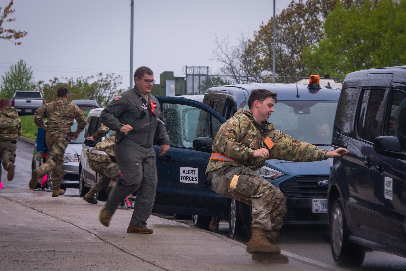 U.S. Air National Guard Airmen assigned to the 134th Operations Group run from their alert facility into vans as part of an alert response during a Nuclear Operational Readiness Exercise at McGhee Tyson Air National Guard Base, Tennessee.