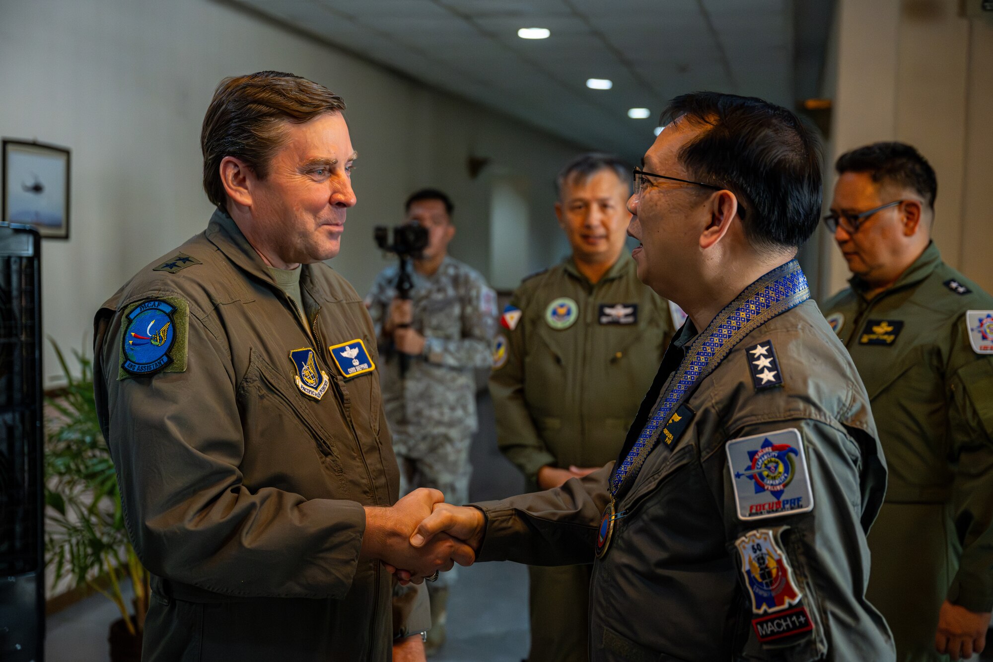 U.S. Air Force Maj. Gen. Chris Sheppard, Air National Guard assistant to the Commander, Pacific Air Forces, shakes hands with Philippine Air Force Lt. Gen. Arthur Cordura, Philippine Air Force commanding general, before the opening ceremony of exercise Cope Thunder.