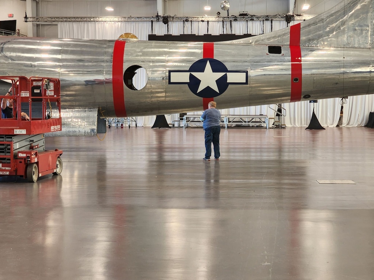 Michele Elliott, 97th Maintenance Squadron electronics integrated systems mechanic, admires the restoration work done on the B-29 Superfortress ‘Doc’ in Wichita, Kansas, March 2025. Michele and her husband, Robert, have spent more than half of their weekends in 2025 assisting in the final touches of Doc’s restoration. (Courtesy photo)