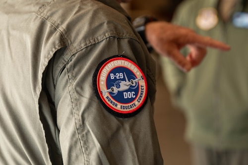 Steve Zimmerman, B-29 Superfortress ‘Doc’ aircraft commander, wears a Doc patch while briefing a tour in Wichita, Kansas, April 2, 2025. Maintainers and flight engineers who work on Doc have gained the nickname ‘Doc’s Friends.’ (U.S. Air Force photo by Senior Airman Kari Degraffenreed)