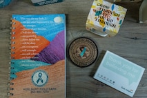 A variety of Sexual Assault Prevention and Response materials are displayed on a table in the SAPR office
