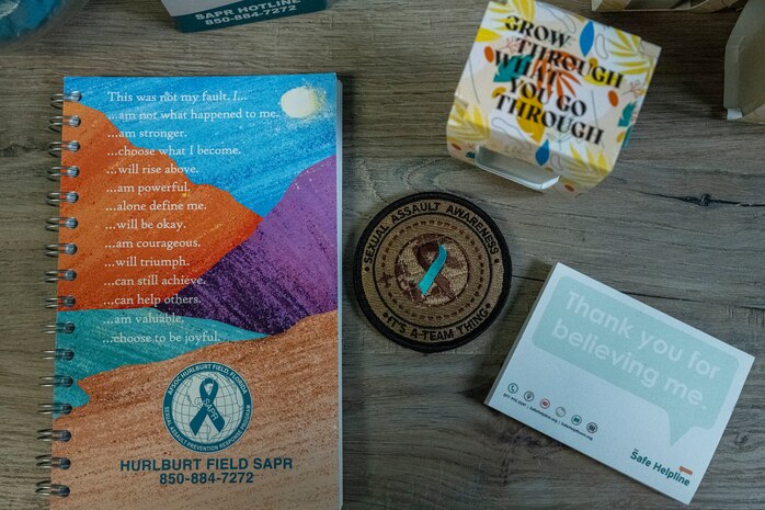 A variety of Sexual Assault Prevention and Response materials are displayed on a table in the SAPR office