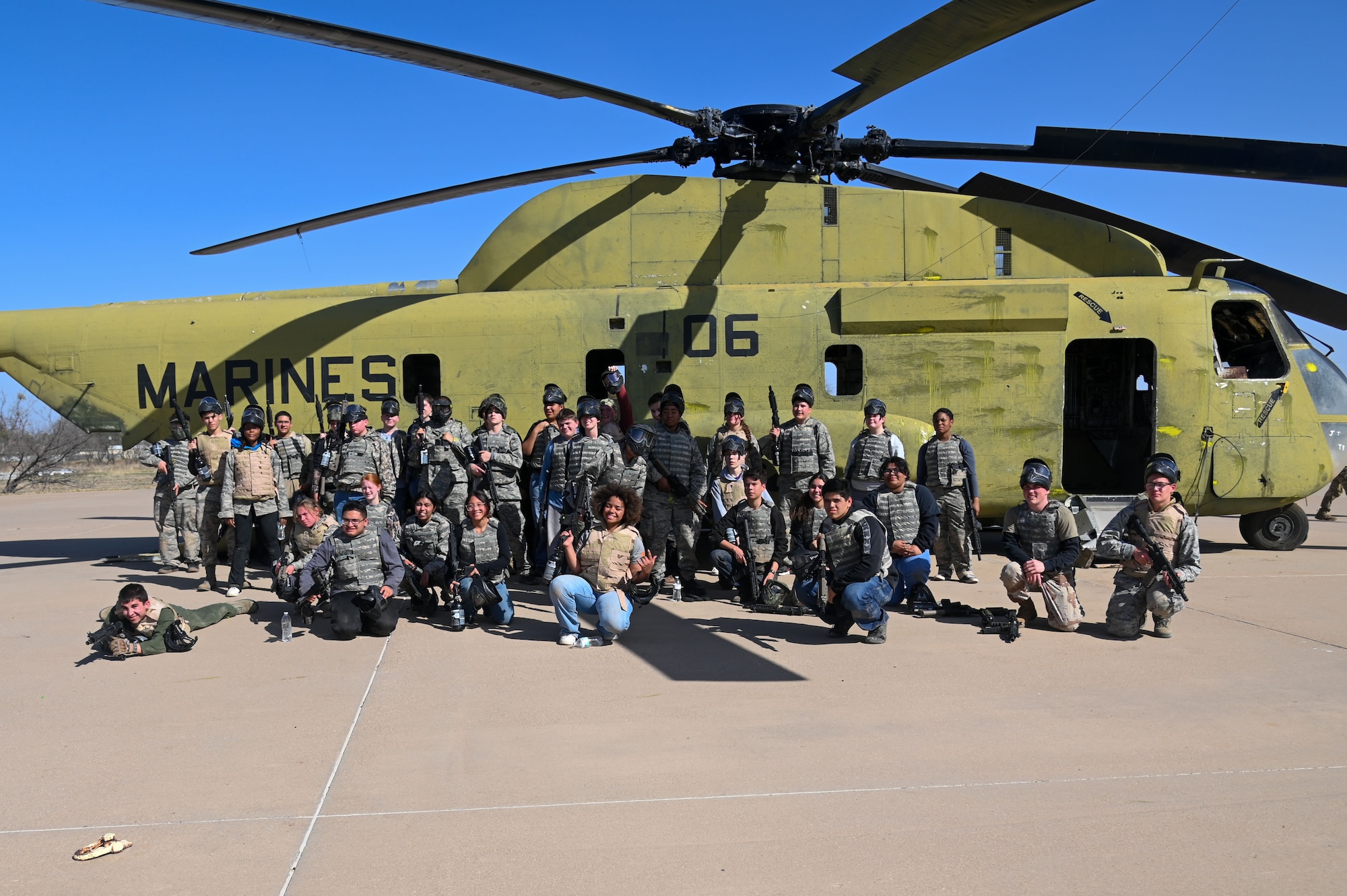 Central High School Air Force Junior ROTC pose in front of a decommissioned U.S. Marine Corps Sikorsky CH-53A Sea Stallion following a field training exercise at Goodfellow Air Force Base, Texas, March 7, 2025. Cadets strengthened their camaraderie by facing challenging situations and making decisions under pressure.  (U.S. Air Force photo by Airman 1st Class James Salellas)