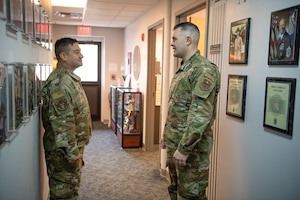 Image of two men talking.