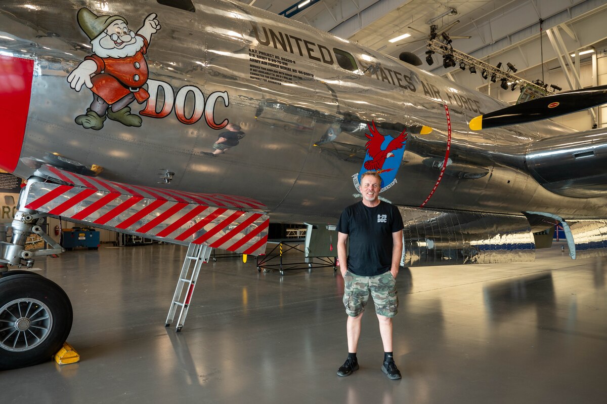 Donald Obreiter, 97th Maintenance Squadron director and lead flight engineer on the B-29 Superfortress ‘Doc’, poses with Doc in Wichita, Kansas, April 2, 2025. Obreiter has overseen the maintenance of Doc since 2012 and was part of the test flight crew the first time the restored aircraft took flight in 2016. (U.S. Air Force photo by Senior Airman Kari Degraffenreed)