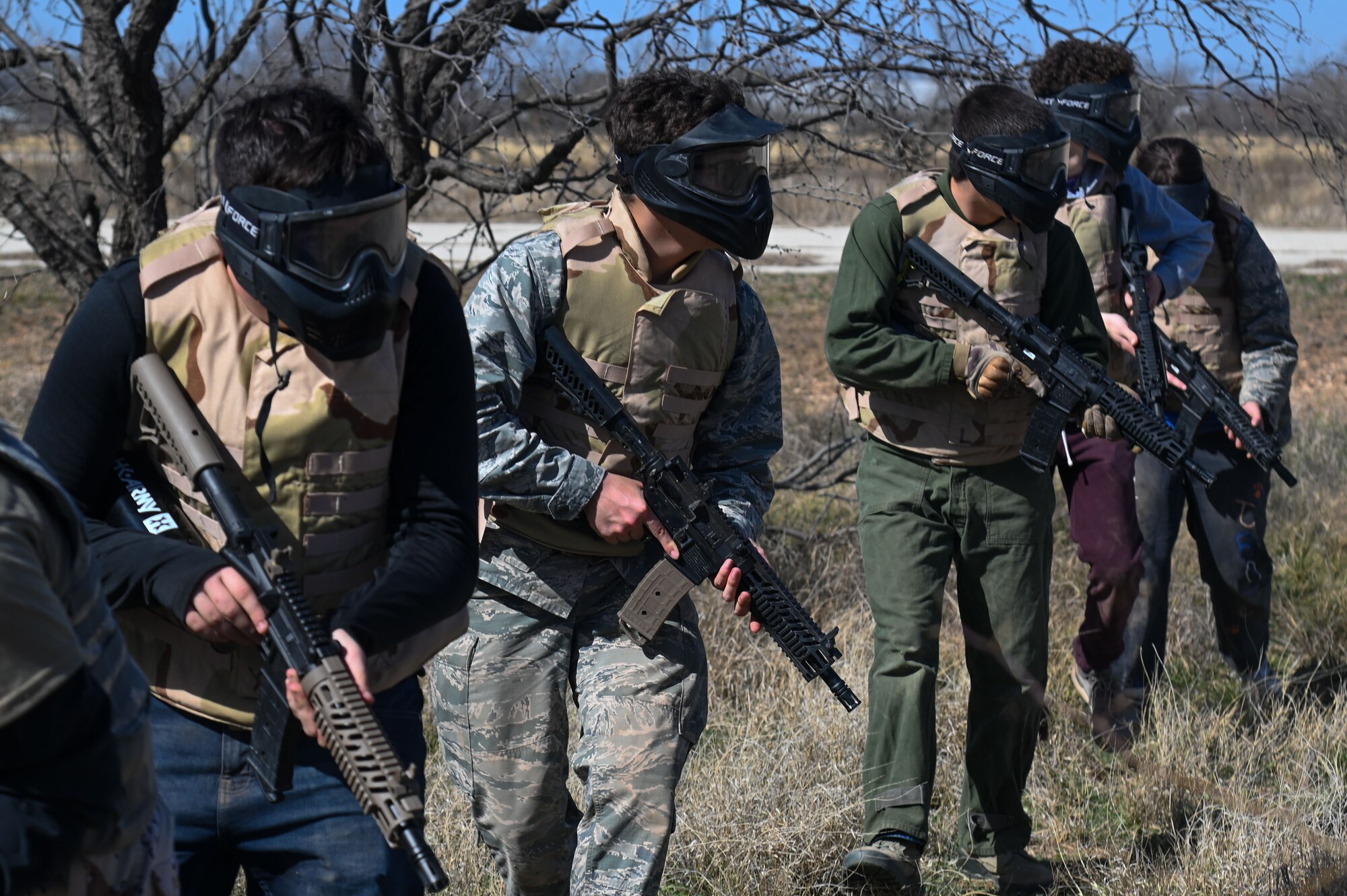 Central High School Air Force Junior ROTC participated in a simulated firefight during their field training exercise at Goodfellow Air Force Base, Texas, March 7, 2025. JROTC is a high school elective with an Air Force structure combining aspects of a military organization with classroom instruction, hands-on leadership training and responsibilities, plus opportunities for extracurricular team and community service participation. (U.S. Air Force photo by Airman 1st Class James Salellas)