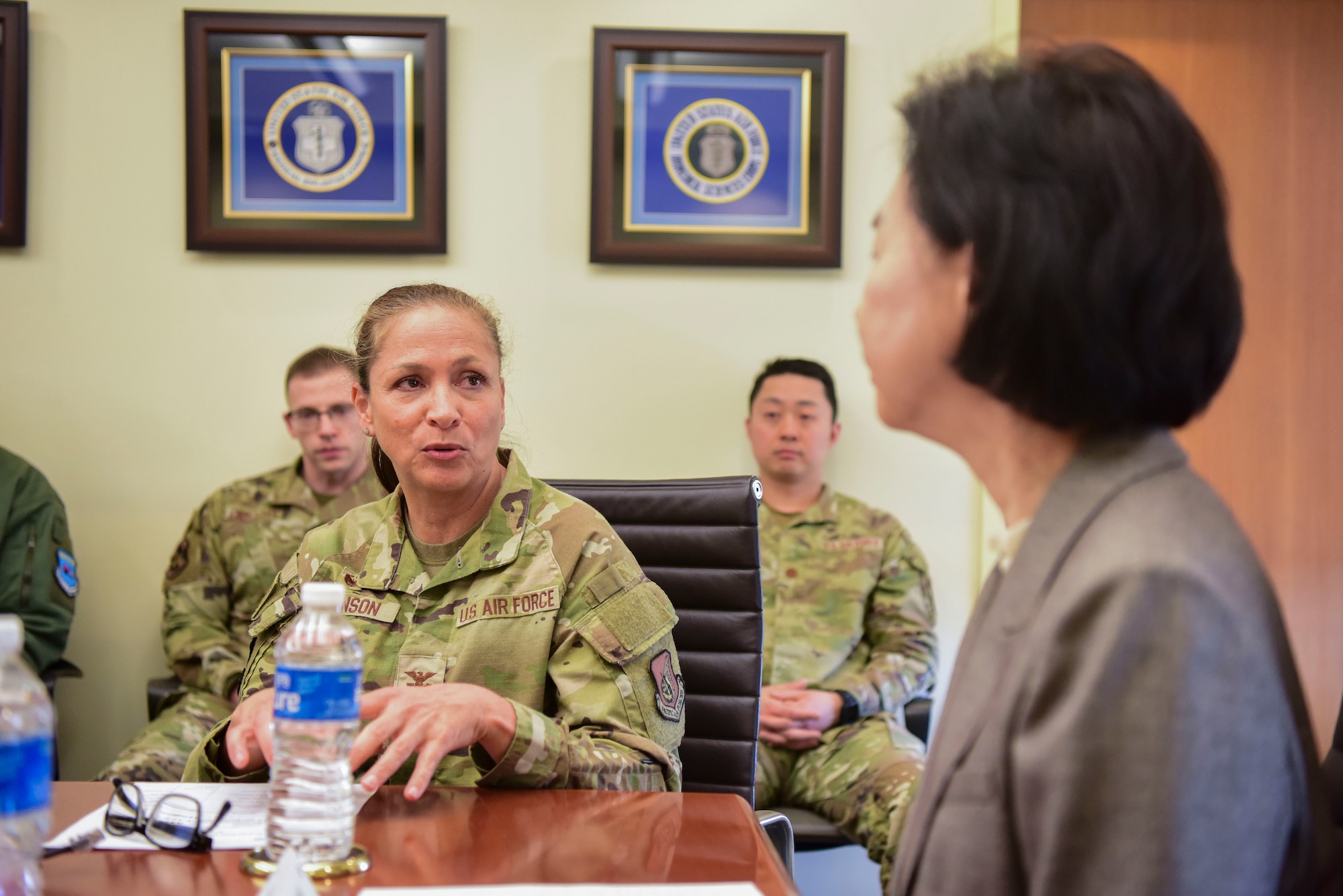 U.S. Air Force Col. Mocha Robinson, 51st Medical Group commander, center left, speaks with Dr. Young Mee Jee, Korea Disease Control Agency commissioner, right, at Osan Air Base, Republic of Korea, April 3, 2025.