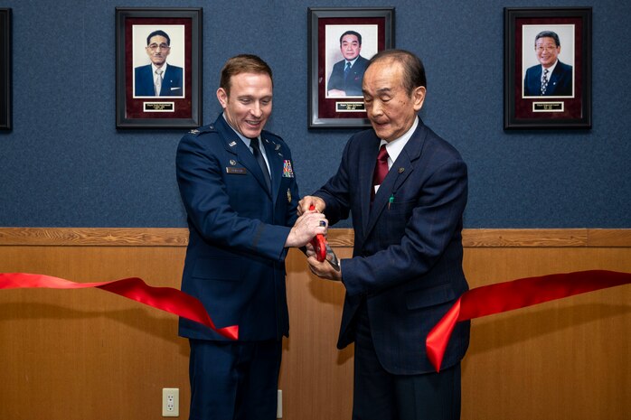 U.S. Air Force Col. Paul Davidson, left, 35th Fighter Wing commander, and Yoshinori Kohiyama, Misawa City mayor, cut a ribbon during the Mayor’s Room Grand Opening Ceremony at Misawa Air Base, Japan, April 4, 2025.