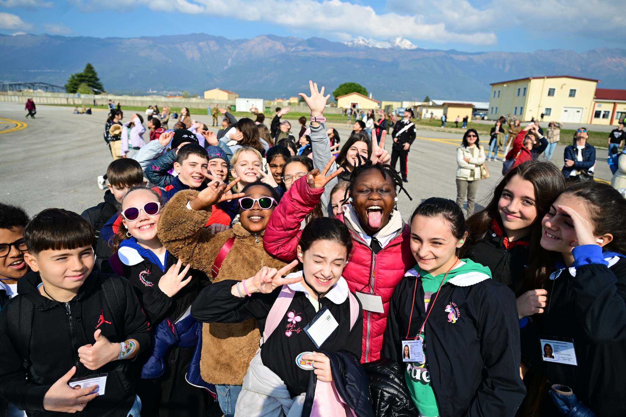 Children pose for a photo during the Frecce Tricolori demonstration.
