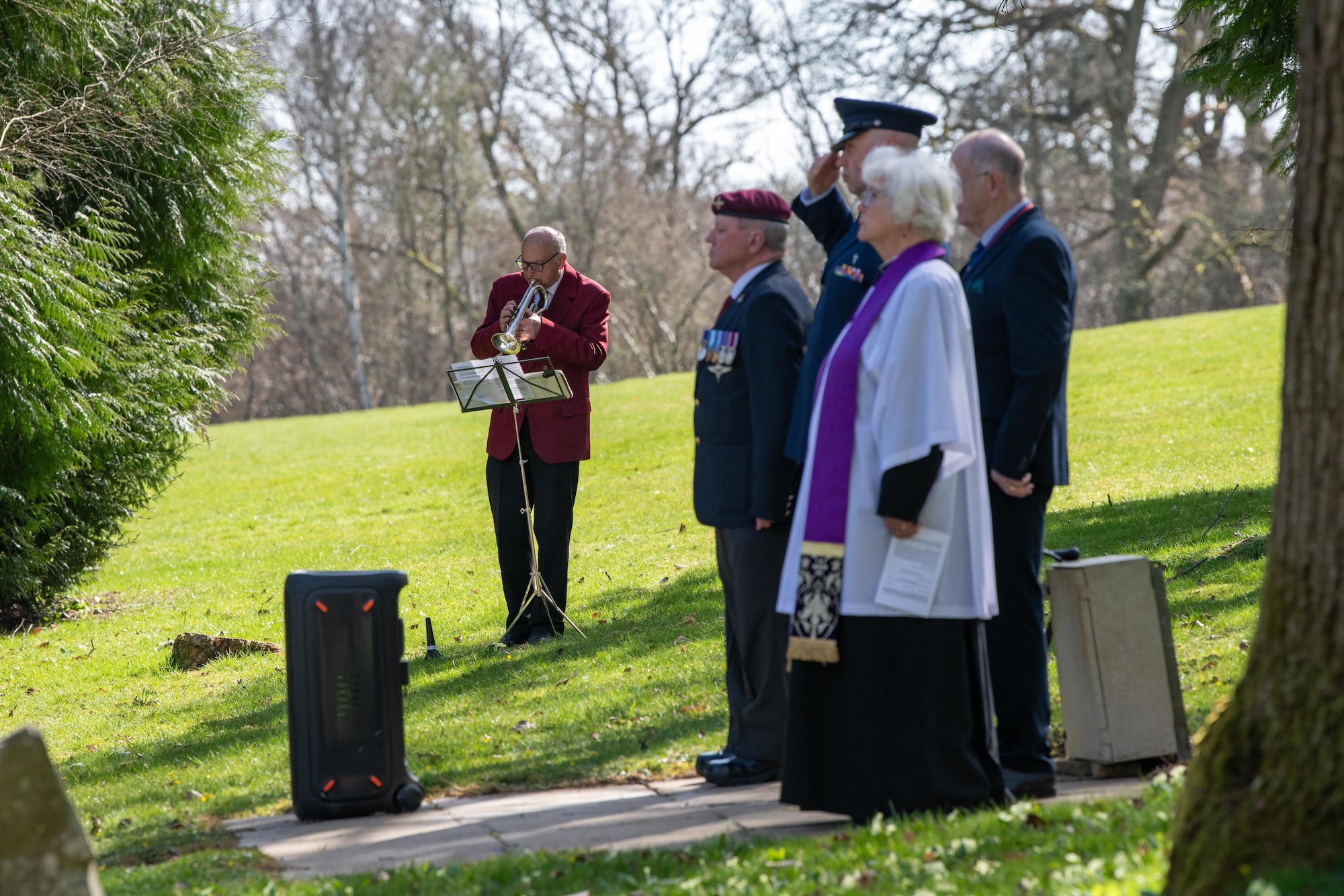 A bugler sounds the last post during a memorial service