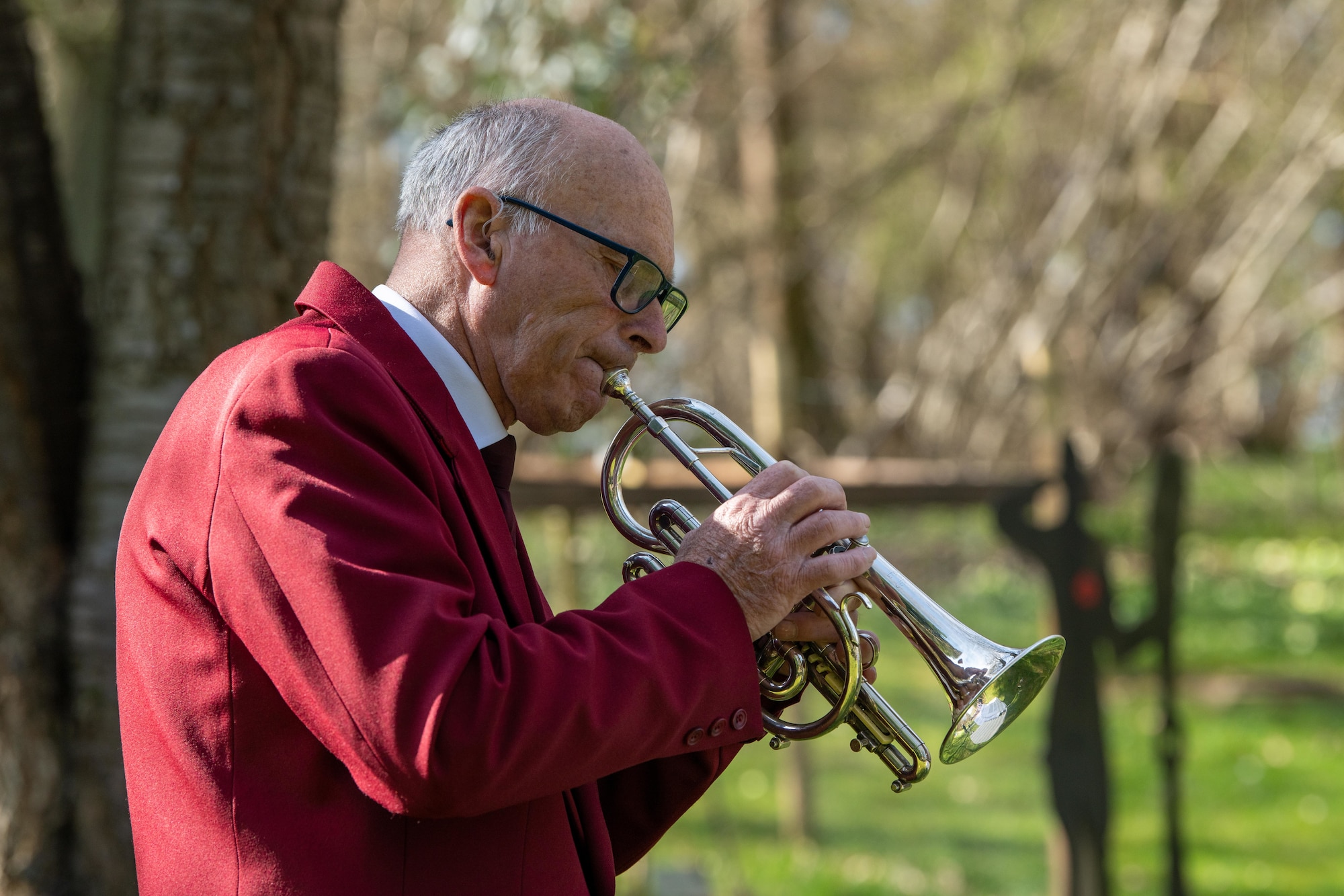 A bugler sounds the last post during a memorial service