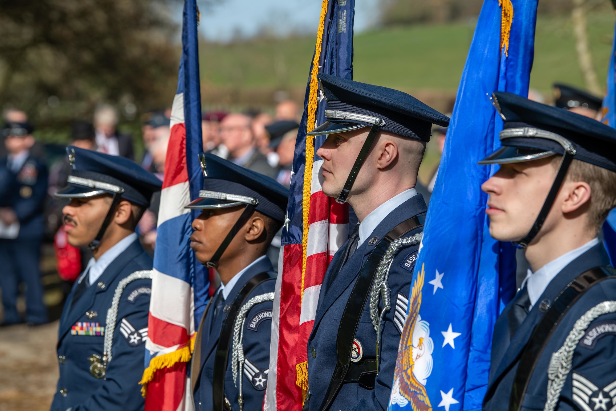 Airmen from the 422nd Air Base Group honor guard stand at attention during a memorial service