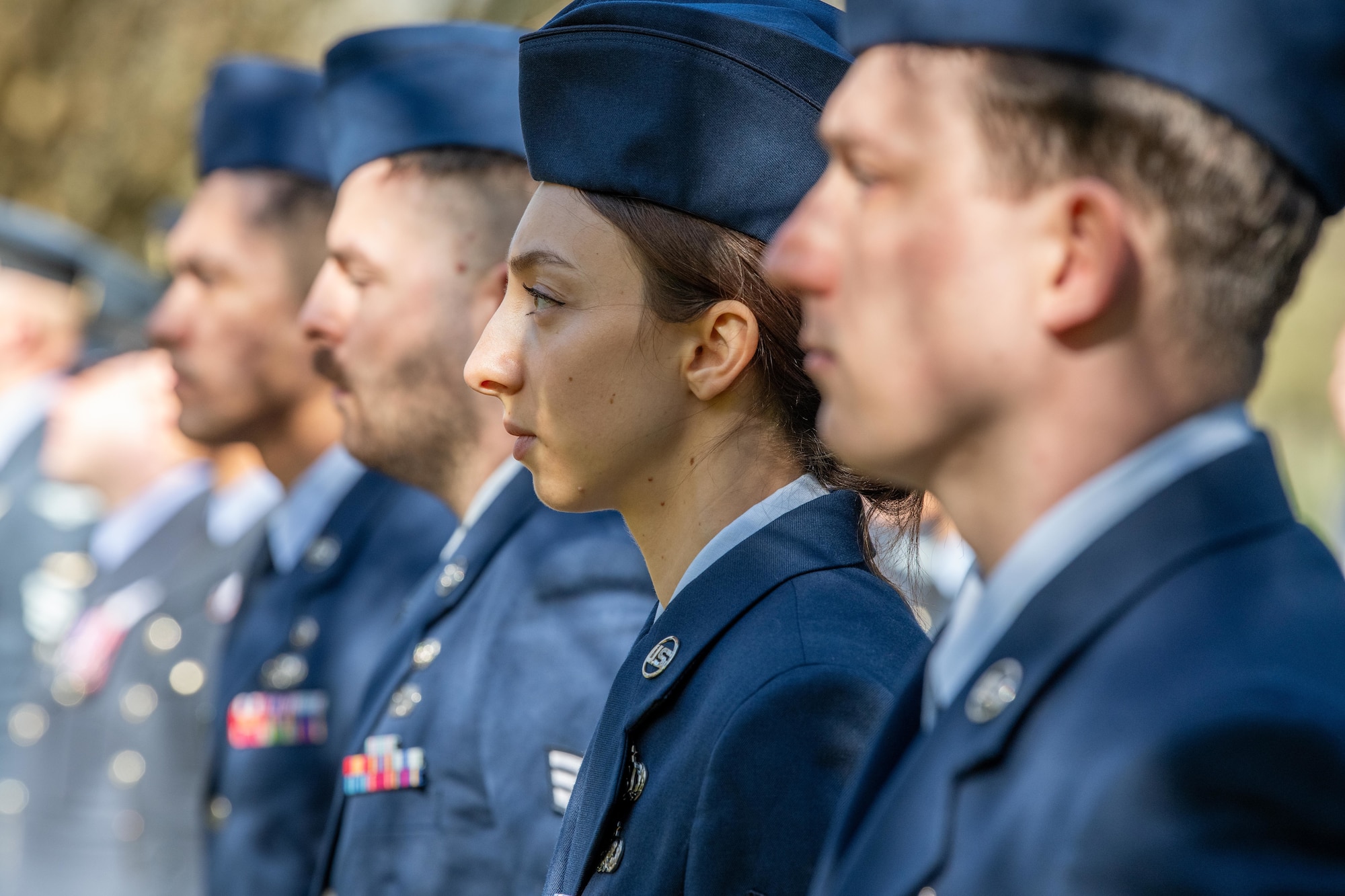 Airmen from the 420th Munitions Squadron stand at attention during a memorial service