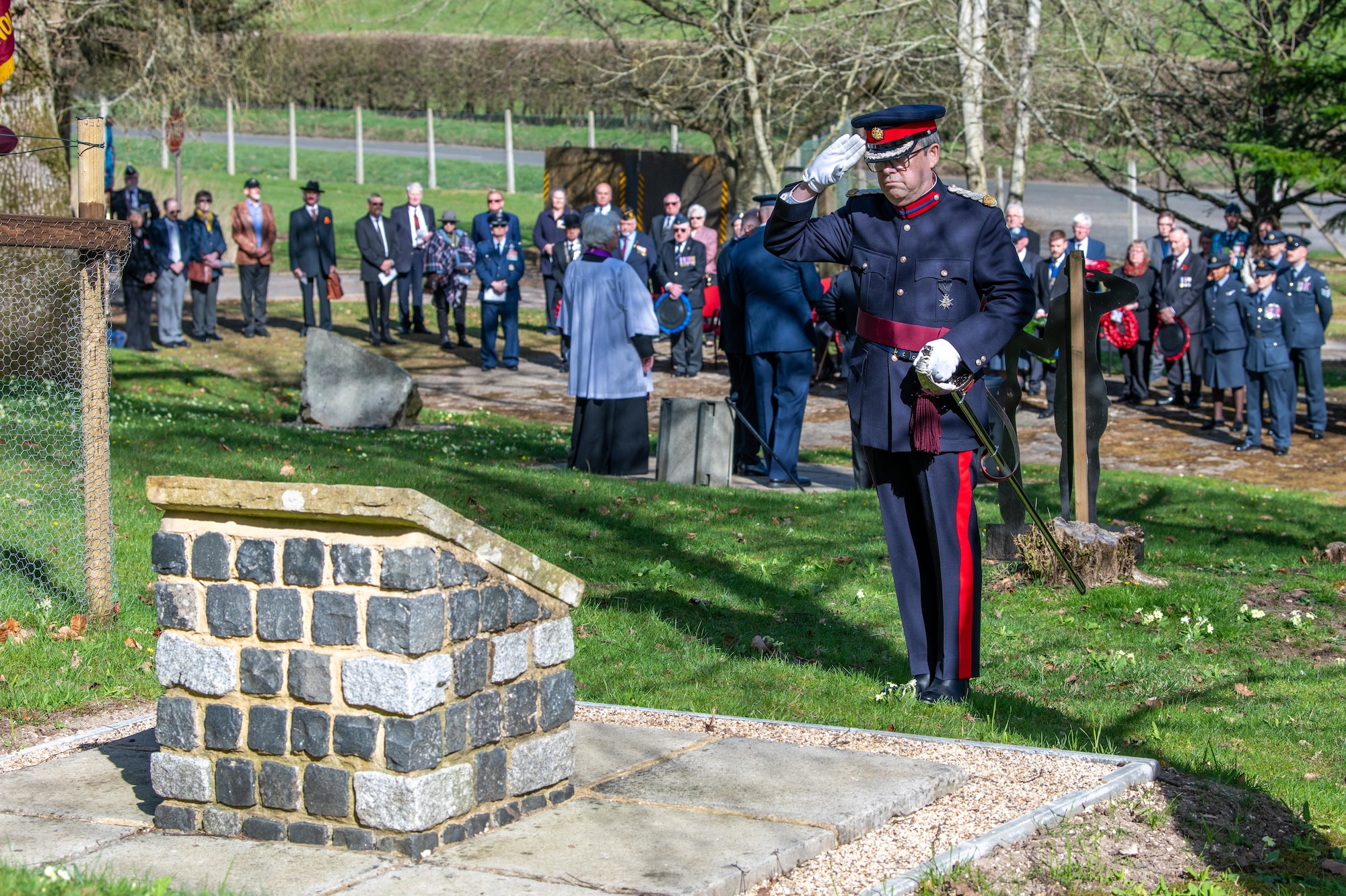 Vice lord-lieutenant of Berkshire renders a salute during a memorial service