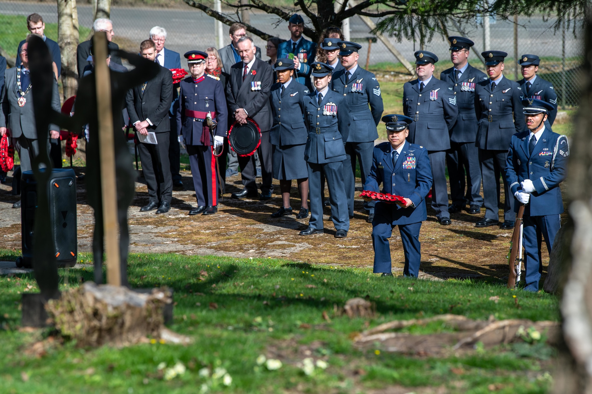 U.S. Air Force Squadron commander prepares to lay a wreath during a memorial service