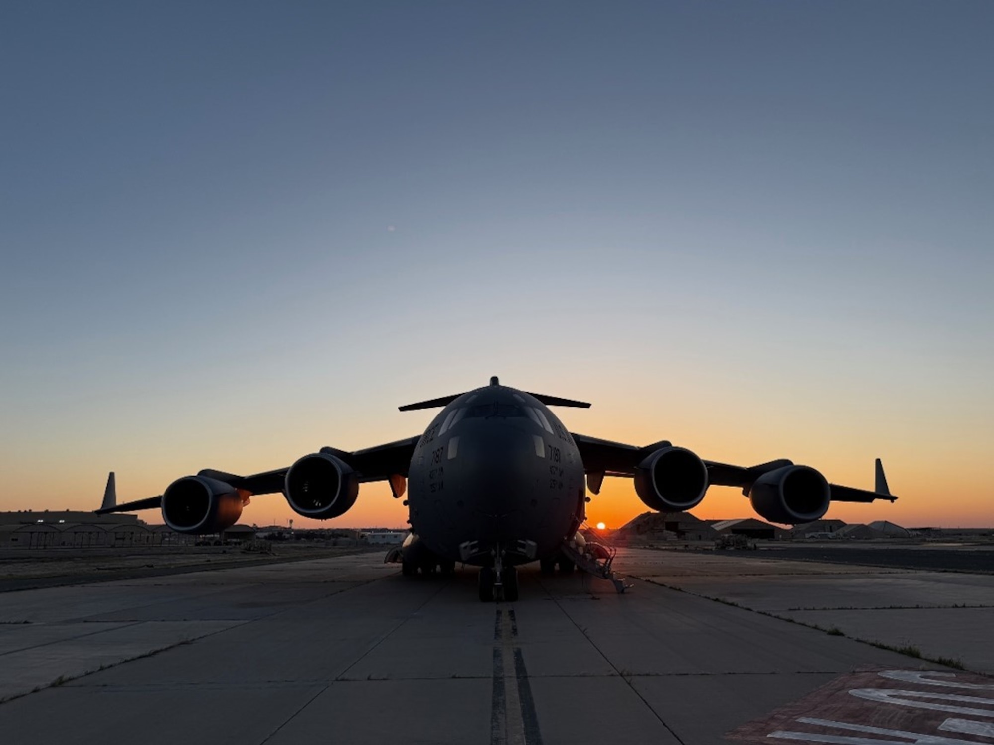 A U.S. Air Force C-17 Globemaster III aircraft assigned to the 6th Airlift Squadron sits on the flight line at an undisclosed date and location, no date. As the most heavily tasked C-17 squadron in the Air Force during the first quarter of 2025, the 6th AS enabled strategic movements across every combatant command, showcasing the squadron’s role in delivering Rapid Global Mobility at the speed of relevance. (U.S. Air Force courtesy photo)