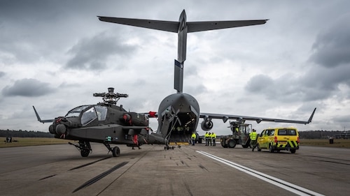 U.S. Air Force loadmasters assigned to the 6th Airlift Squadron offload an AH-64 Apache helicopter assigned to the Royal Netherlands Air Force from a C-17 Globemaster III aircraft at an undisclosed location, no date. The mission was part of a broader effort supporting combatant command requirements around the globe, reflecting the 6th AS’s ability to rapidly deliver combat-ready assets. These operations reinforce the squadron’s vital role in providing maneuver and sustainment for the Joint Force. (Royal Netherlands Air Force courtesy photo)