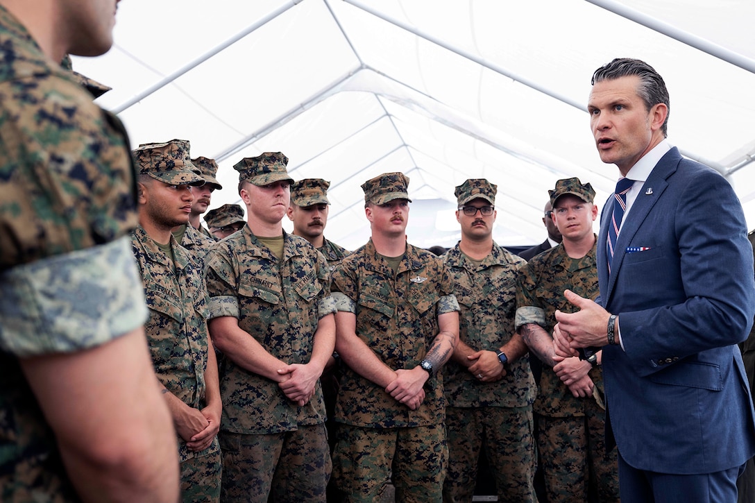 Defense Secretary Pete Hegseth speaks to a group of Marines.
