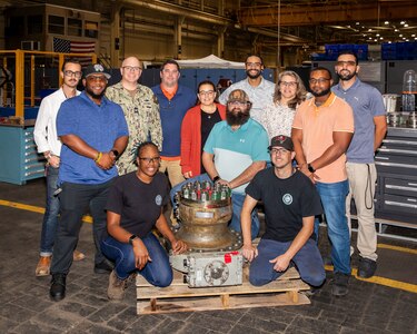 Norfolk Naval Shipyard (NNSY) Shop 31 recently tested the pilot of the model line initiative with their auxiliary ballast tanks, utilizing principles from Dr. Steven Spear and learnings from Portsmouth Naval Shipyard (PNSY) to complete repairs that had previously taken approximately 150 days to now 35 days. This initiative was a huge win for the shipyard and was thanks to the teamwork from Shop 31, Code 100TO and the engineering department to ensure pre-planning and material acquisition was handled prior to the start of the job to ensure the mechanics could conduct non-stop execution of work.