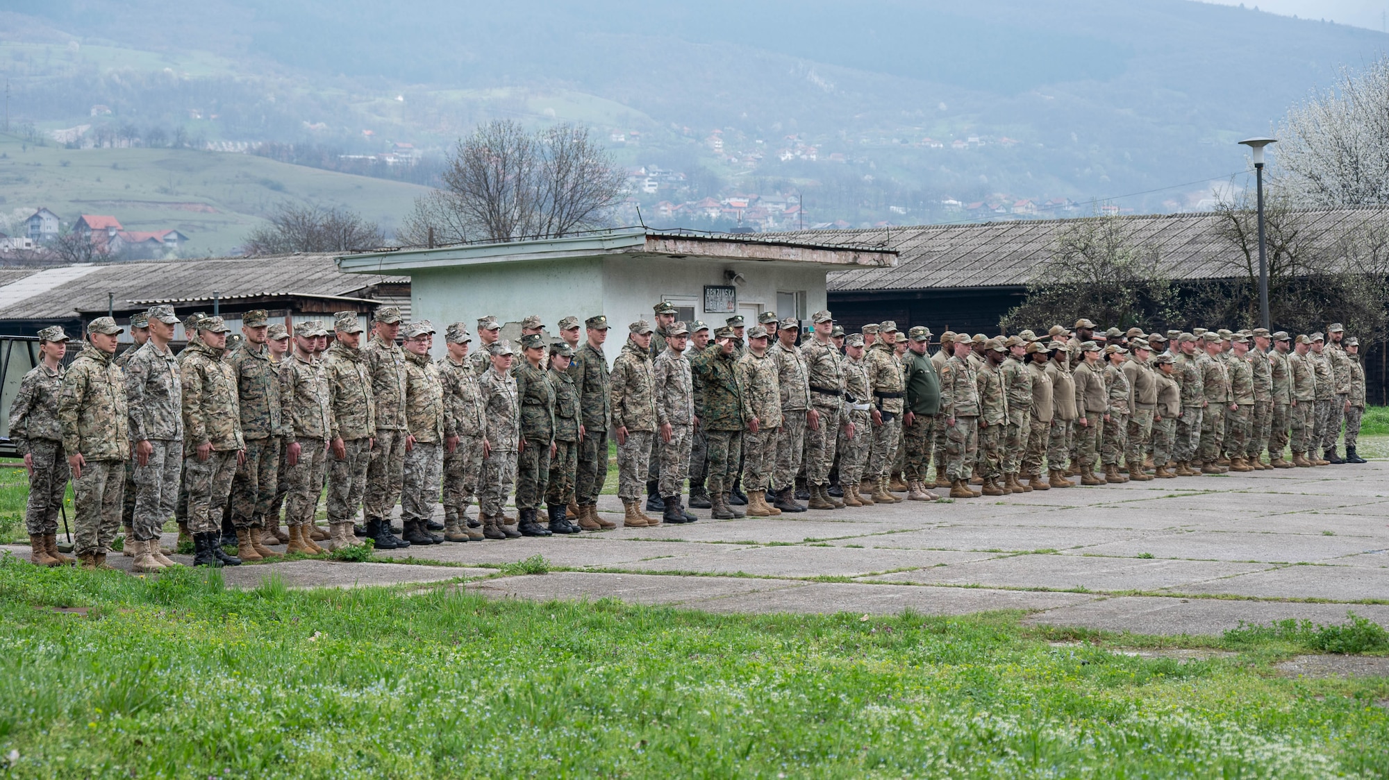Maryland National Guardsmen and Armed Forces of Bosnia and Herzegovina members stand at attention to welcome distinguished visitors at the AFBiH base in Zenica, Bosnia and Herzegovina, on April 4, 2025.