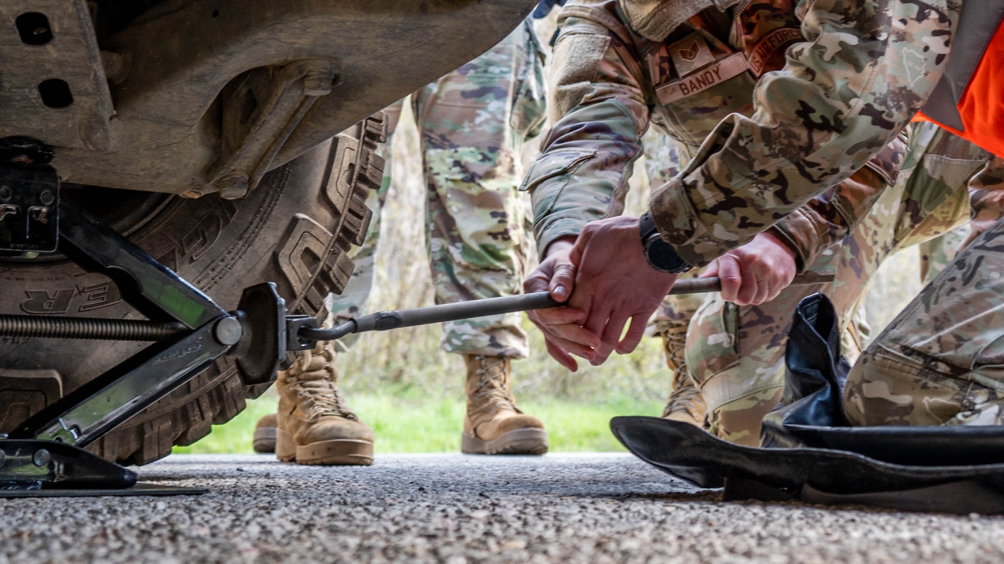 Maryland Air National Guard Staff Sgt. Jonathan Bandy, a vehicle mechanic with the 175th Logistics Readiness Squadron, and a member of the Armed Forces of Bosnia and Herzegovina change a tire during a convoy from Zenica to Visoko, in Lašva, Bosnia and Herzegovina, April 7, 2025.