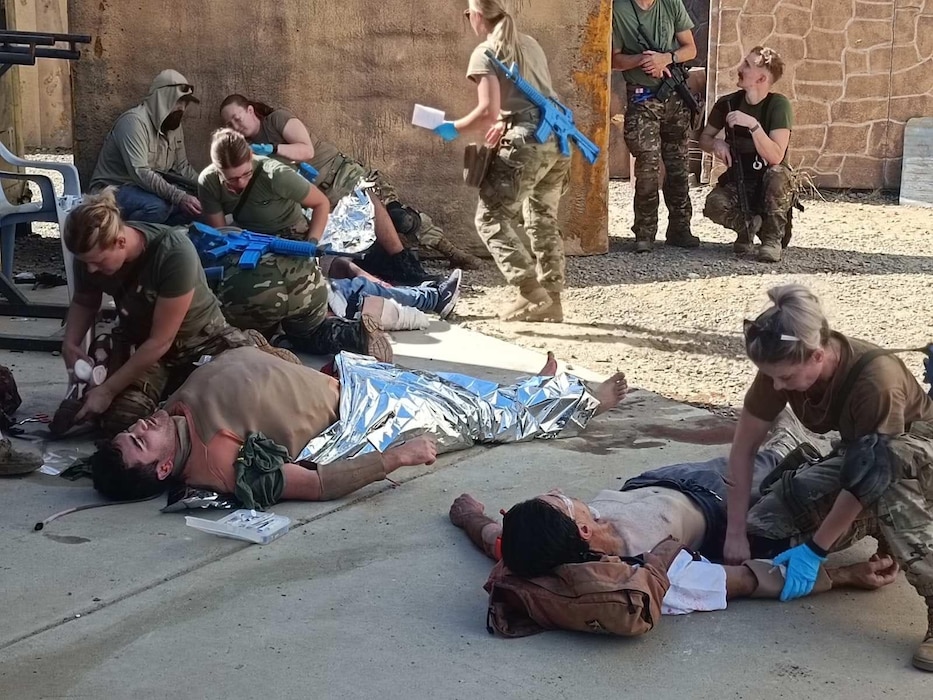 Airmen from the 140th Medical Group, Colorado Air National Guard simulate performing emergency medical care alongside members of the Colorado Army National Guard and Slovenian Armed Forces while participating in a course from Strategic Operations, Inc. (STOPS) in San Diego, Sept. 2-6, 2024. STOPS provides hyper-realistic tactical training services and products to the military, law enforcement, first responders, and other organizations responsible for homeland security. (U.S. Air National Guard photo by Staff Sgt. Elizabeth Fischer)