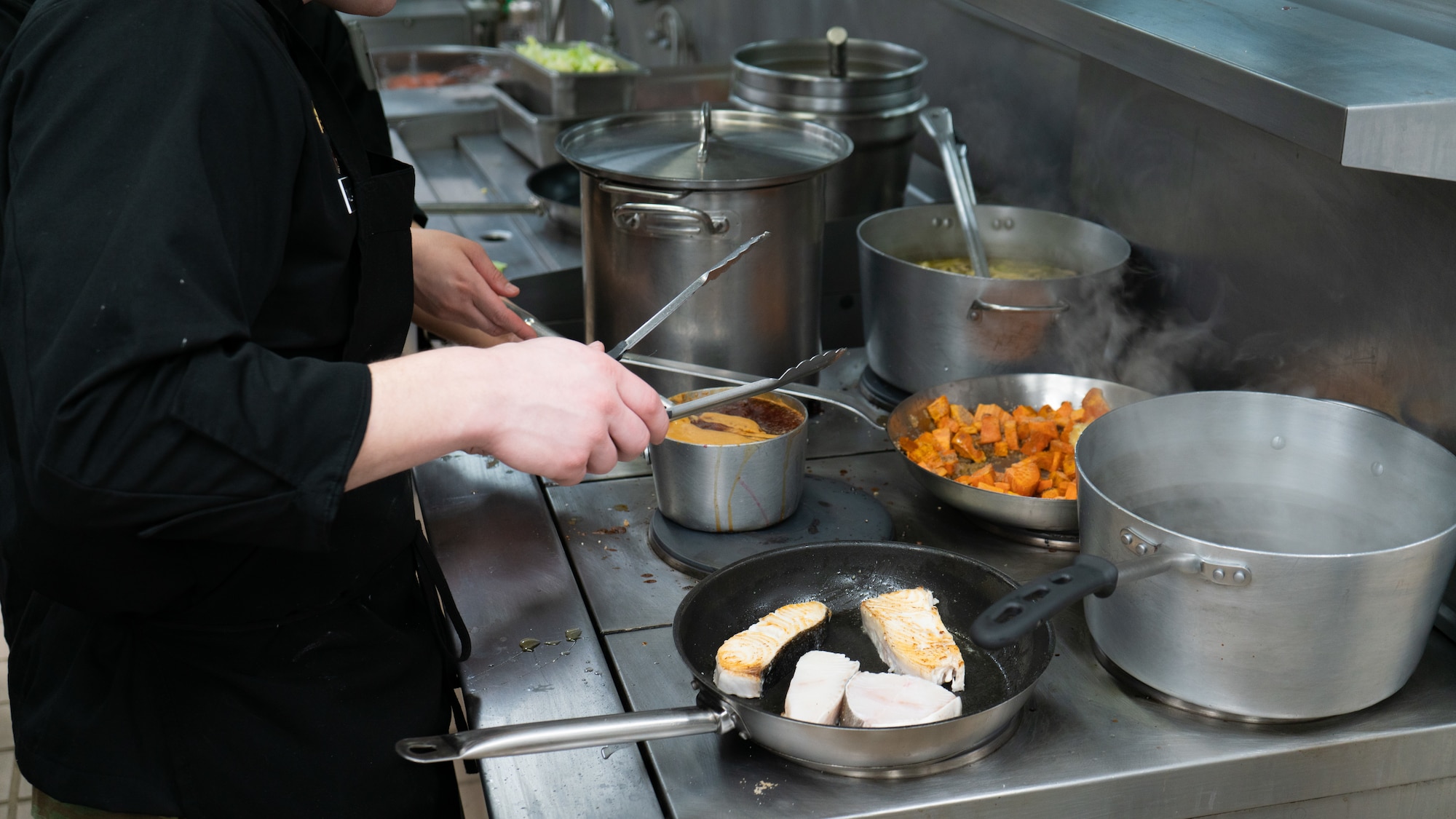 U.S. Army Sgt. Zane Williams, 1st Infantry Brigade Combat Team, 11th Airborne Division culinary NCO, prepares ingredients during a cooking competition at the Wolves Den Warrior Restaurant on Fort Wainwright, Alaska, March 27, 2025.