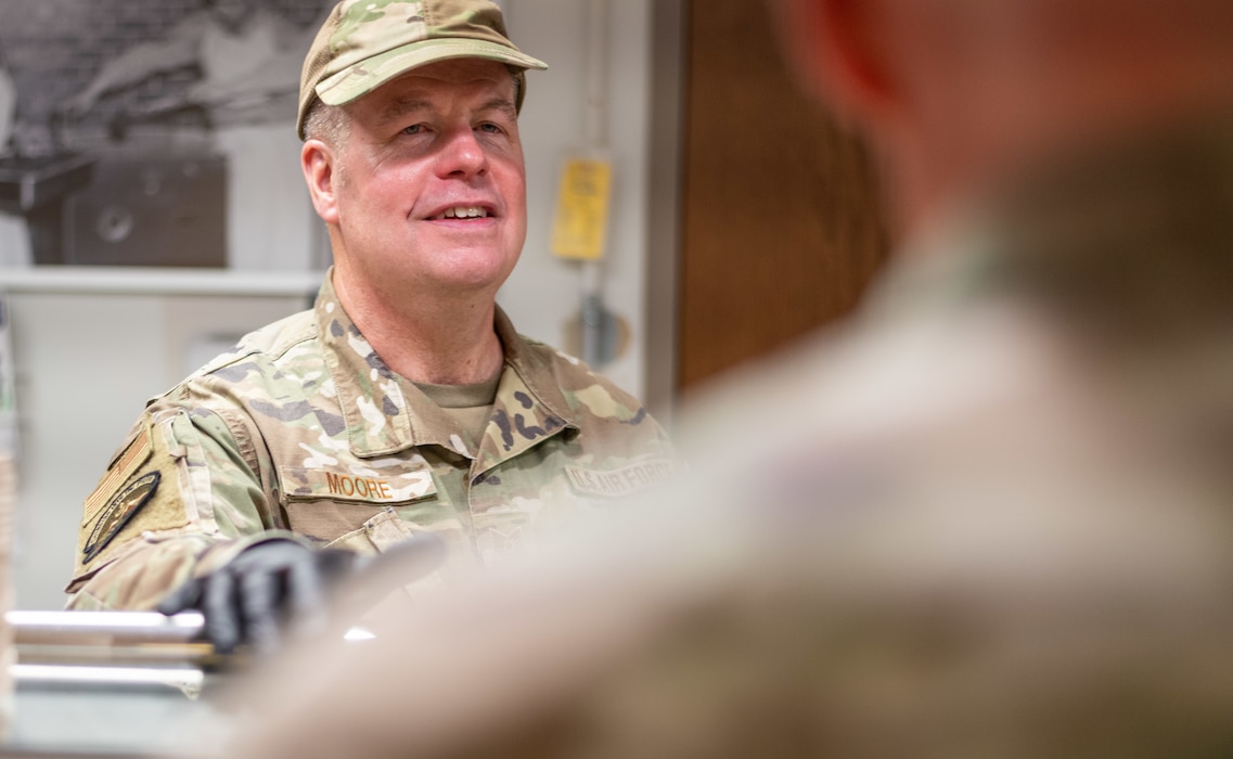 Tech. Sgt. Nicholas Moore from the 140th Services Flight serves food during a drill weekend at Buckley Space Force Base, Colo. Oct. 6, 2024. The Services Flight provides meals for airmen when on duty. (U.S. Air National Guard Photo by Capt. Benjamin Kimball)