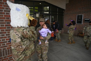 JB the JBLE Eagle Mascot meets a service member's child