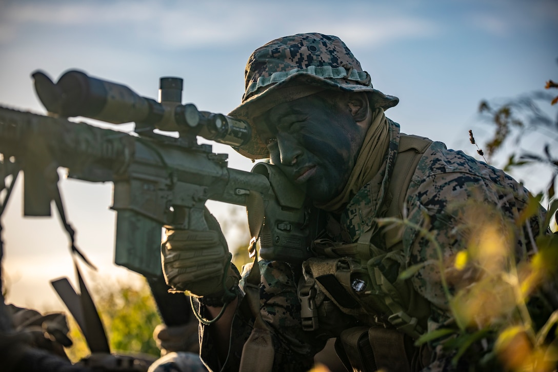 A U.S. Marine with Bravo Company, 4th Reconnaissance Battalion, 4th Marine Division, provides security around the dropzone after a military free-fall special insertion during exercise Baltic Operations (BALTOPS) 24 at Gotland, Sweden, June 10, 2024. BALTOPS 24 is the premier maritime-focused exercise in the Baltic Region. The exercise, led by U.S. Naval Forces Europe-Africa and executed by Naval Striking and Support Forces NATO, provides a unique training opportunity to strengthen combined response capabilities critical to preserving freedom of navigation and security in the Baltic Sea. (U.S. Marine Corps photo by Sgt. Andy O. Martinez)